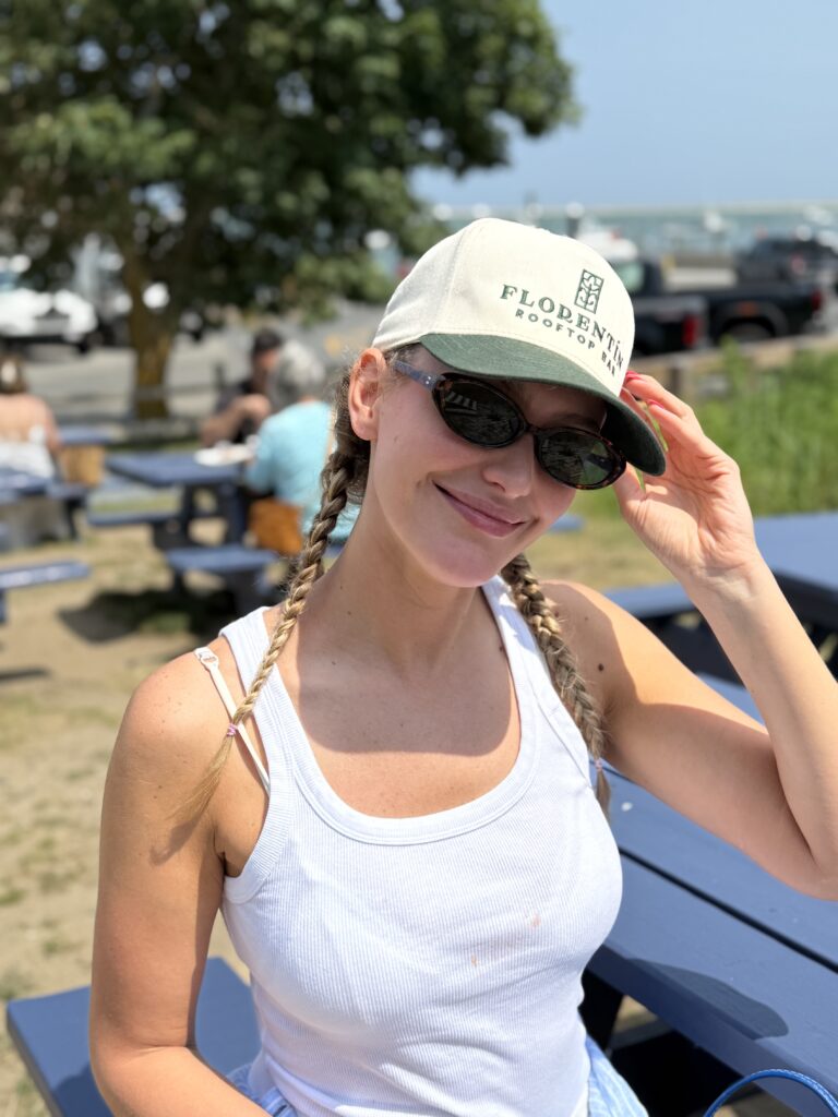 Woman wearing a cream and green Florentín cap outdoors