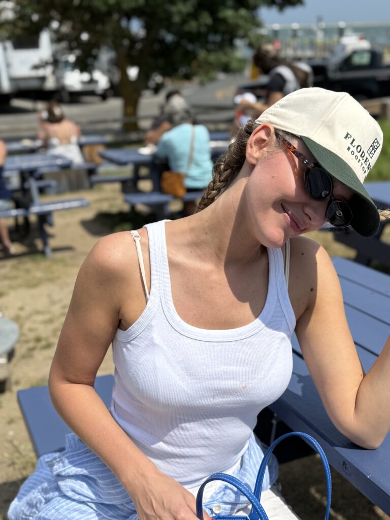 Florentín cap styled with a white tank top on a sunny day